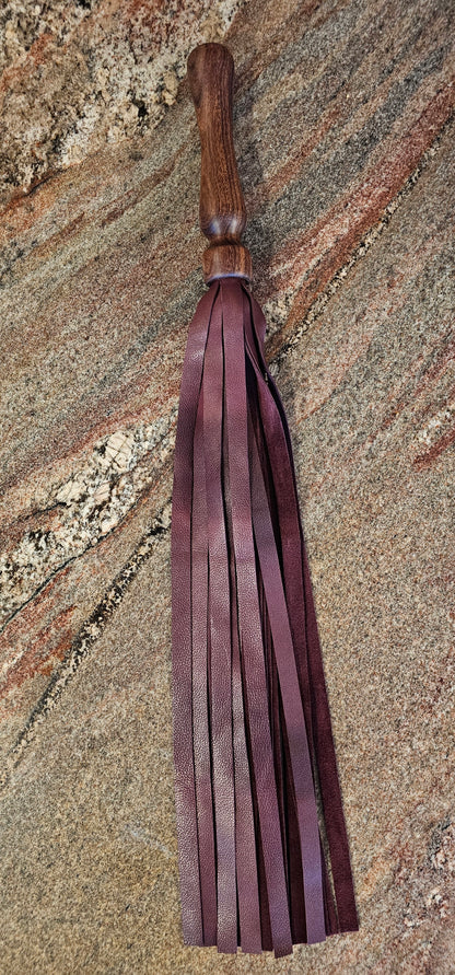 Walnut handle flogger with Maroon leather falls